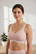 Front angle of woman wearing petal blush recovery bra